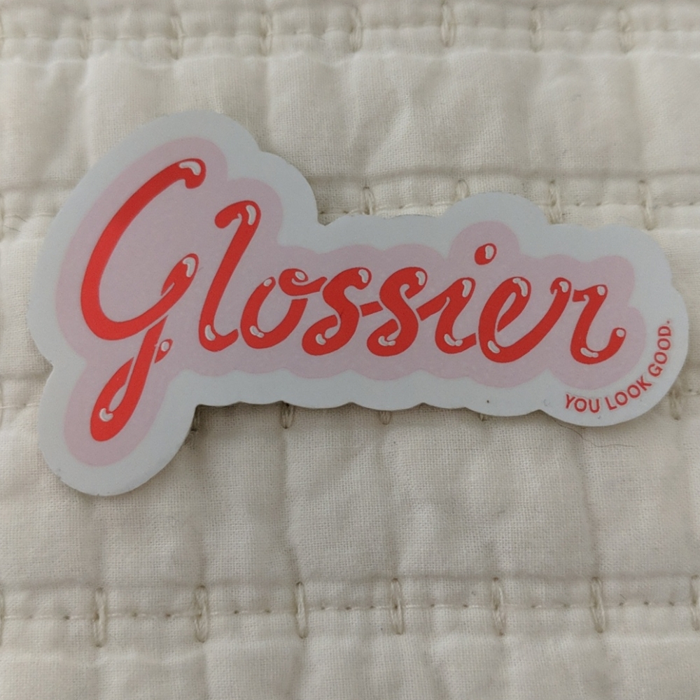 Glossier pouch and sticker